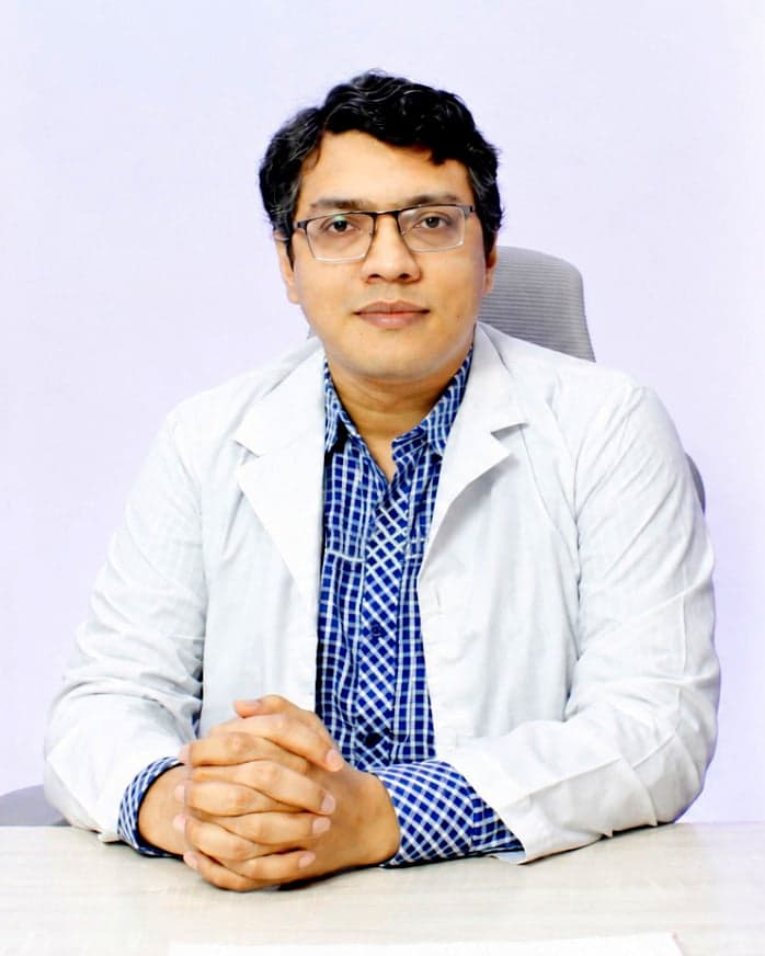 Dr. Afanur Rahman Adnan seated at his consultation desk